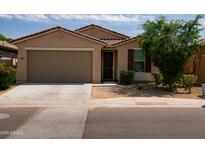 Charming single-story home with a two-car garage, desert landscaping, and a tile roof, perfect for low-maintenance living at 2723 W Apollo Rd, Phoenix, AZ 85041
