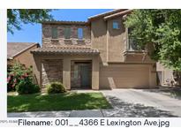 Charming two-story home with a well-manicured lawn and a neutral color scheme at 4366 E Lexington Ave, Gilbert, AZ 85234