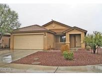 Charming single-story home with a well-maintained front yard and covered entry way at 10752 W Rio Vista Ln, Avondale, AZ 85323