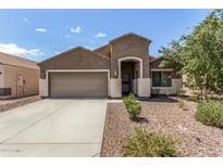 Charming single-story home featuring a two-car garage and low-maintenance desert landscaping at 12041 W Melinda Ln, Sun City, AZ 85373
