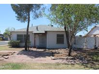 Charming single-story home with a well-maintained yard and classic architectural details at 1367 E Clarendon Ave, Phoenix, AZ 85014