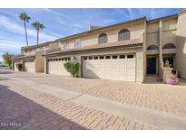 Charming townhouse with a two-car garage and well-maintained brick driveway at 2142 E Turney Ave # 9, Phoenix, AZ 85016
