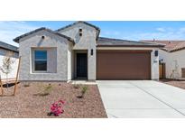 Charming home featuring a low-maintenance landscape and a two-car garage at 23404 W Burton Ave, Buckeye, AZ 85326