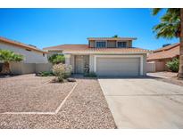 Charming two-story home featuring a well-maintained yard, desert landscaping, and a classic tile roof at 4319 E Tanglewood Dr, Phoenix, AZ 85048