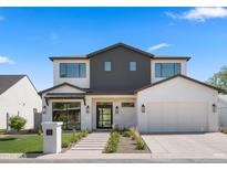 Stunning two-story home with modern design elements and professional landscaping at 4911 E Amelia Ave, Phoenix, AZ 85018
