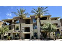 Attractive condominium building with palm trees, balconies, and a well-maintained facade at 7601 E Indian Bend Rd # 1049, Scottsdale, AZ 85250