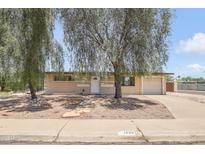 Charming single-story home with mature trees offering shade and curb appeal at 1526 W Huntington Dr, Tempe, AZ 85282