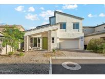 Stylish two-story home with a two-car garage and modern architectural details and low-maintenance front yard at 16027 N 74Th Ln, Peoria, AZ 85382