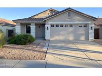 Charming single-story home featuring a tile roof, well-maintained landscaping, and an attached two-car garage at 3027 W Red Fox Rd, Phoenix, AZ 85083