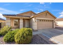 Charming single-Gathering home with a well-maintained front yard, desert landscaping, and a two-car garage at 3027 W Red Fox Rd, Phoenix, AZ 85083