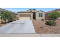 Charming single-story home with a two-car garage and low-maintenance desert landscaping at 31006 W Weldon Ave, Buckeye, AZ 85396