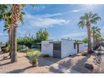Well-maintained condo exterior showcasing modern design, landscaping, and desert plants at 4206 N 38Th St # 1, Phoenix, AZ 85018
