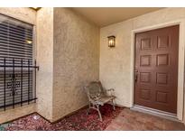 Inviting front porch featuring a classic bench and a secure, stylish front door at 5208 S Deborah Dr, Tempe, AZ 85283