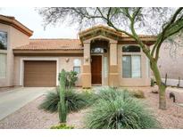 Inviting front exterior with desert landscaping, tile roof, and covered entry, showcasing the home's curb appeal at 14000 N 94Th St # 1031, Scottsdale, AZ 85260