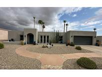 Contemporary home with desert landscaping, including cacti, gravel, and a walkway to the front door at 2426 E Turquoise Dr, Phoenix, AZ 85028