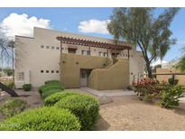 Inviting two-story condo featuring desert landscaping, covered stairs, and a private entrance at 3434 E Baseline Rd # 265, Phoenix, AZ 85042