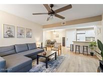 Comfortable living room leading to the eat-in kitchen, dining area, and features modern décor at 540 N May -- # 2110, Mesa, AZ 85201