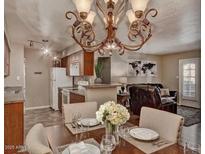 Inviting dining room with chandelier, connected to the kitchen and living area; perfect for gatherings at 5995 N 78Th St # 1047, Scottsdale, AZ 85250