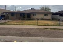 Charming single-story home with a fenced yard, and covered porch at 25 W Illini St, Phoenix, AZ 85041