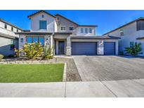 Charming two-story home with a three car garage, manicured lawn, and desert landscaping at 4507 S 119Th Dr, Avondale, AZ 85323