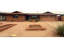 Charming brick home featuring desert landscaping and a well-maintained exterior at 4537 E Emelita Ave, Mesa, AZ 85206