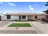 Charming single-story home with a well-maintained front yard and a convenient covered carport at 6313 W Carol Ave, Glendale, AZ 85302