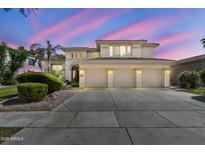 Stunning two-story home featuring a three-car garage and well-maintained landscaping at 1951 W Bartlett Ct, Chandler, AZ 85248