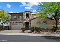 Charming two-story home with stone accents, covered porch, and meticulously landscaped front yard at 22925 N 46Th St, Phoenix, AZ 85050