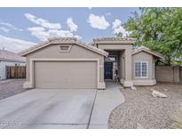 Charming single-story home featuring a two-car garage, desert landscaping, and a welcoming front entrance at 2579 E Camellia Dr, Gilbert, AZ 85296