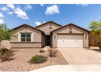 Charming single-story home featuring a well-maintained front yard and a two-car garage at 3264 E Luna Dr, San Tan Valley, AZ 85143