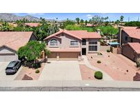 Beautiful two-story home featuring a spacious three-car garage and well-manicured desert landscaping at 3926 E Lavender Ln, Phoenix, AZ 85044