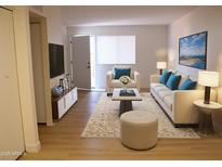 Bright living room featuring neutral colors, a comfortable seating area, and stylish decor at 720 S Dobson Rd # 95, Mesa, AZ 85202
