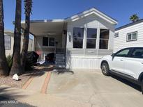 Charming single-story home with well-maintained landscaping, covered porch, and convenient driveway at 1426 S Havasupai Dr, Apache Junction, AZ 85119