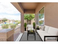 Inviting covered patio featuring a comfortable seating area with stylish outdoor furniture at 1453 W Birch Rd, San Tan Valley, AZ 85140