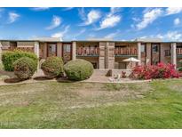 Inviting two-story condo with manicured landscaping, multiple balconies, and a neutral color palette at 4354 N 82Nd St # 178, Scottsdale, AZ 85251