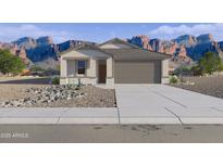 Charming single-story home with a two-car garage and xeriscaped front yard with mountain views at 46438 W Lander Ln, Maricopa, AZ 85139