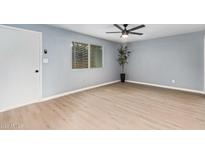 Bright living room with a ceiling fan, nice flooring and plenty of natural light at 6565 N 19Th Ave # 45, Phoenix, AZ 85015