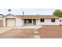 Charming single-story home featuring a well-maintained front yard and inviting entrance at 8334 E Palm Ln, Scottsdale, AZ 85257