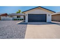 Charming single-Gathering home featuring a modern design, two-car garage, and low-maintenance landscaping at 8455 E Orange Blossom Ln, Scottsdale, AZ 85250