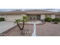 Charming single-story home featuring a well-manicured front yard and a two-car garage at 11012 E Knowles Ave, Mesa, AZ 85209