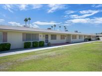 Charming one-story condo with well-maintained lawn and desert landscaping at 13632 N Silverbell Dr, Sun City, AZ 85351
