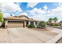 Charming single-story home featuring a two-car garage and desert landscaping at 29915 N Maravilla Dr, San Tan Valley, AZ 85143