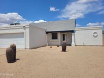 Charming single-story home featuring desert landscaping and a spacious two-car garage at 812 E Piute Ave, Phoenix, AZ 85024