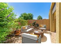 Comfortable outdoor patio featuring stylish seating, lush greenery, and a sunny ambiance for relaxation and entertainment at 1350 S Greenfield Rd # 1125, Mesa, AZ 85206