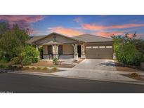 Beautiful single-Gathering home featuring a two-car garage and landscaped front yard, perfect for suburban living at 14634 W Wethersfield Rd, Surprise, AZ 85379