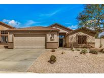 Charming single-story home featuring desert landscaping, a two-car garage, and a warm, inviting entrance at 16055 S 18Th Dr, Phoenix, AZ 85045