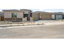 Inviting single-story home featuring a two-car garage, desert landscaping, and a welcoming entrance at 22660 E Pegasus Pkwy, Queen Creek, AZ 85142