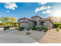 Charming home featuring desert landscaping, a two-car garage, and a desert-toned facade at 343 W Twin Peaks Pkwy, San Tan Valley, AZ 85143