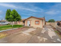Charming single-story home with a well-maintained front yard and a long driveway at 4160 W Granada Rd, Phoenix, AZ 85009