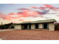 Charming single-story home featuring desert landscaping and covered front porch at 11022 S Iroquois Dr, Phoenix, AZ 85044